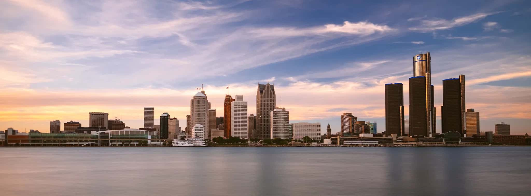 Downtown Detroit, Michigan skyline across the Detroit River at sunset