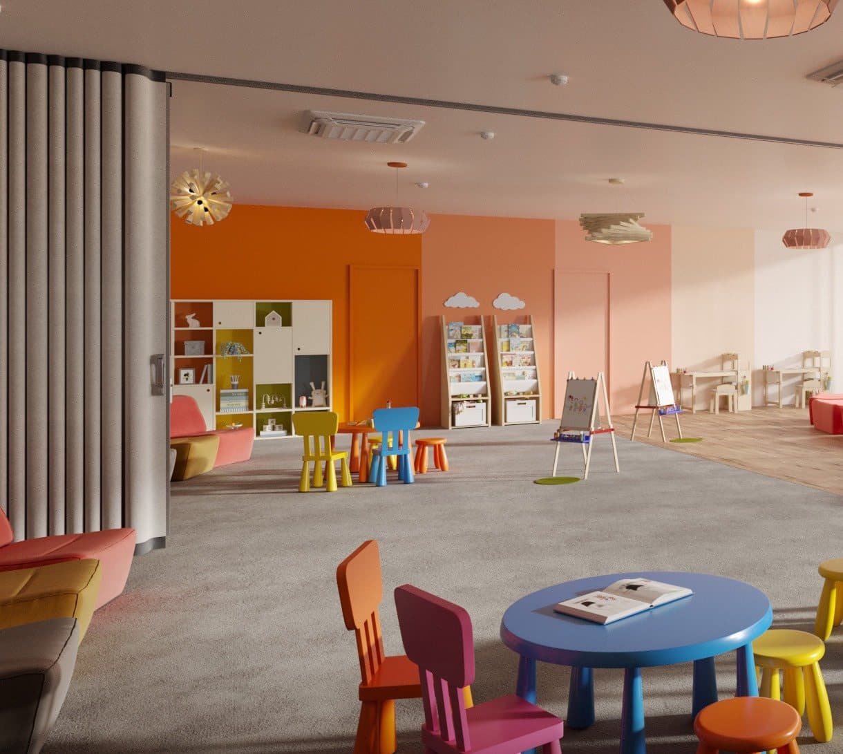 Accordion partition folded into a compact stack at the wall of a bright children's classroom with small tables and chairs