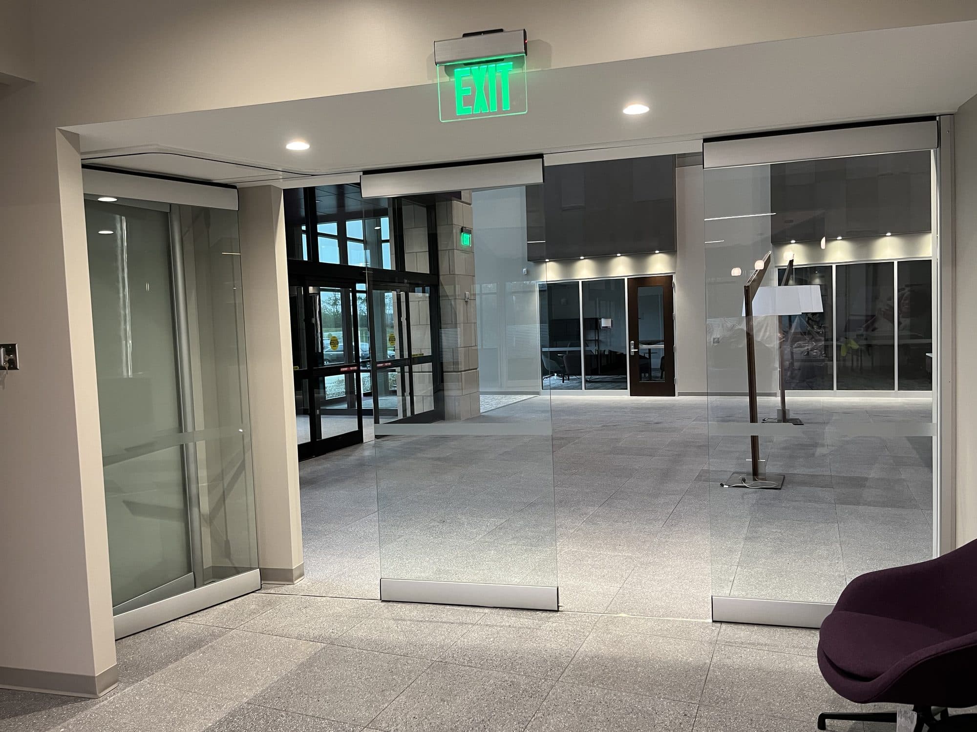 PureView glass panels spaced along the ceiling track as the Modernfold ComfortDrive wall opens, Advia Credit Union, Kalamazoo