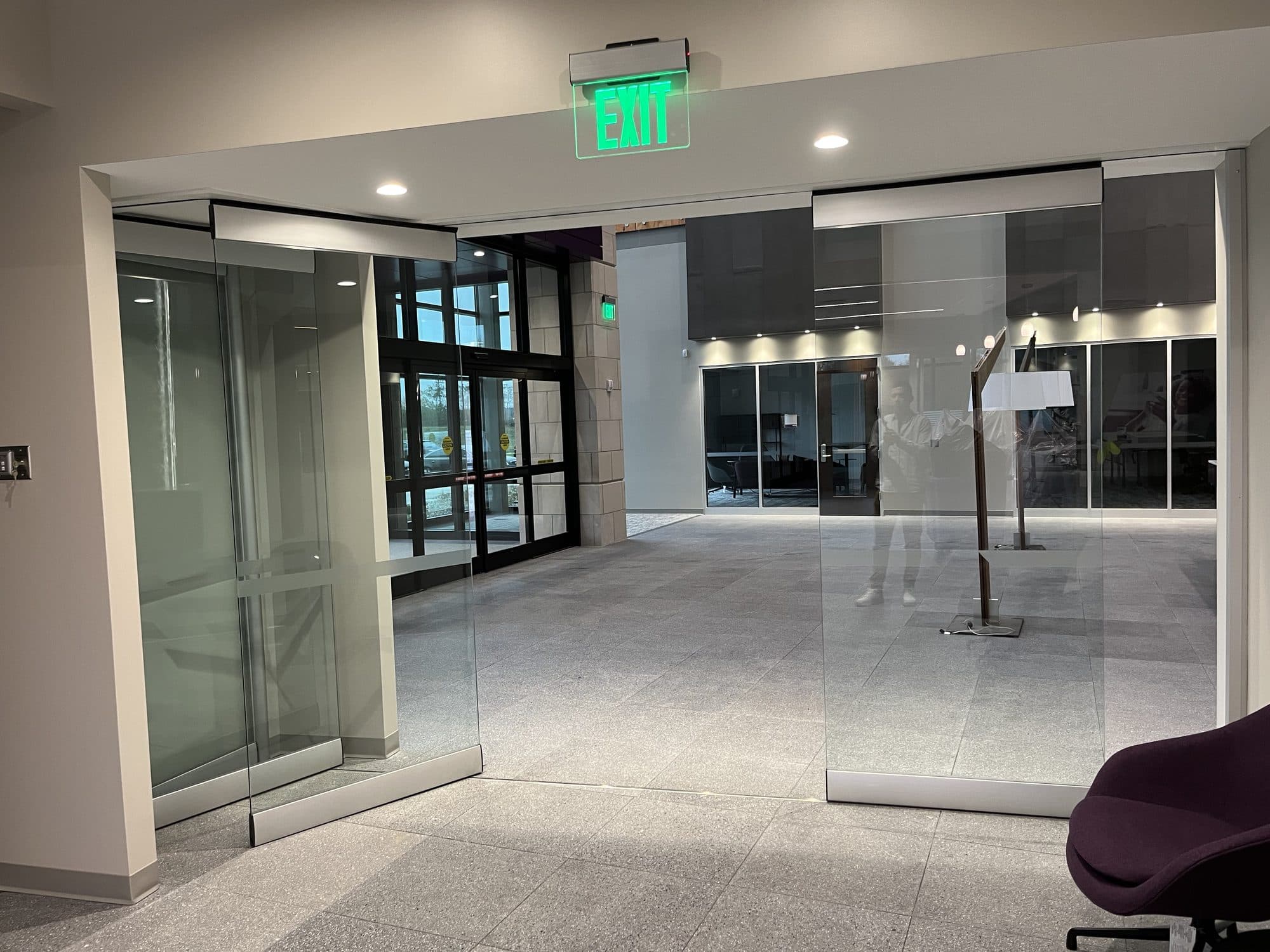 Modernfold ComfortDrive on PureView glass wall partway open, Advia Credit Union, Kalamazoo