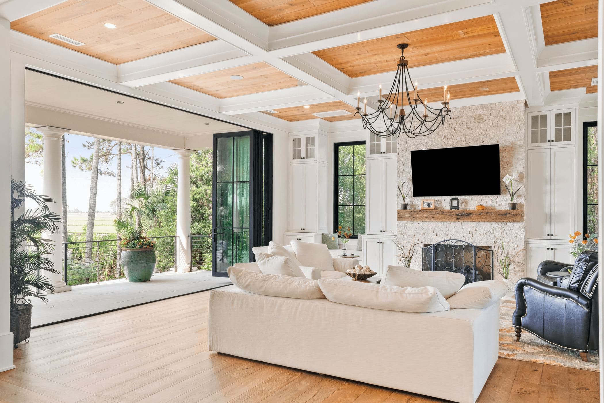 Euro-Wall exterior folding glass opening a living room to an outdoor patio