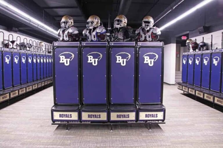 Freestanding island of GearGrid team lockers with helmets on top
