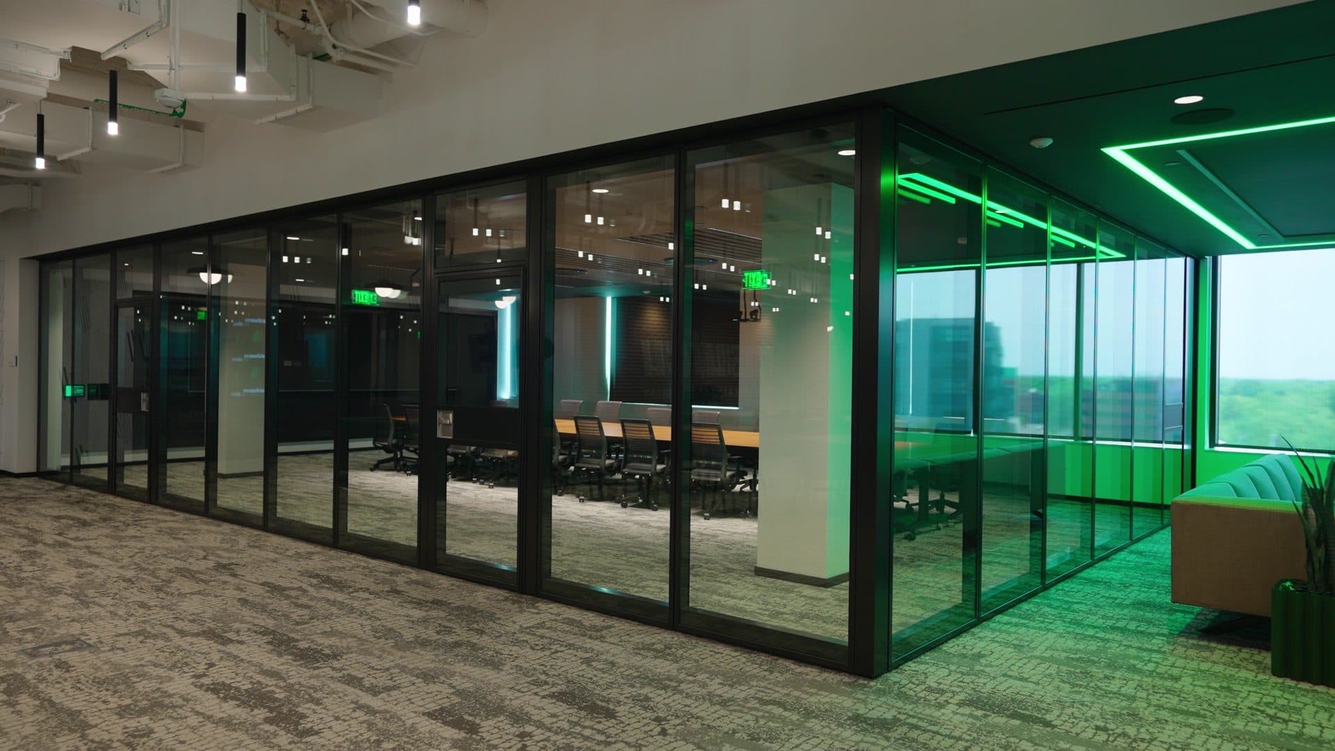 Closed Modernfold ComfortDrive glass operable wall with Acousti-Clear panels enclosing a boardroom at the 311 Abbot Building