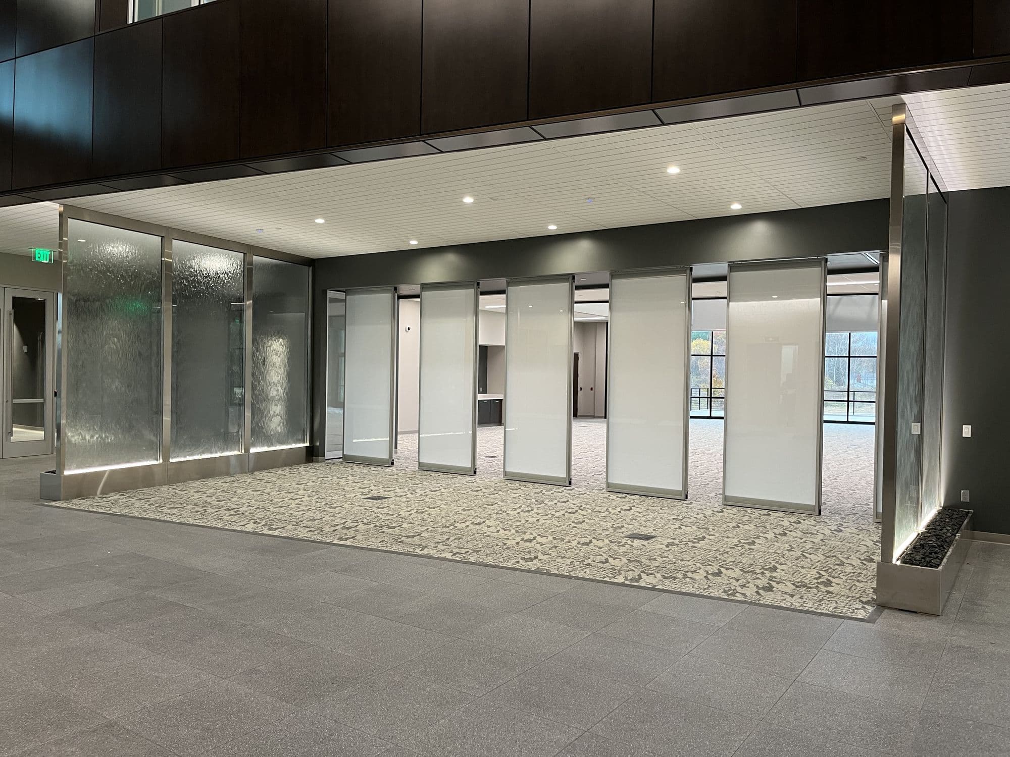 Acousti-Clear panels spaced apart across the opening at Advia Credit Union as the wall opens