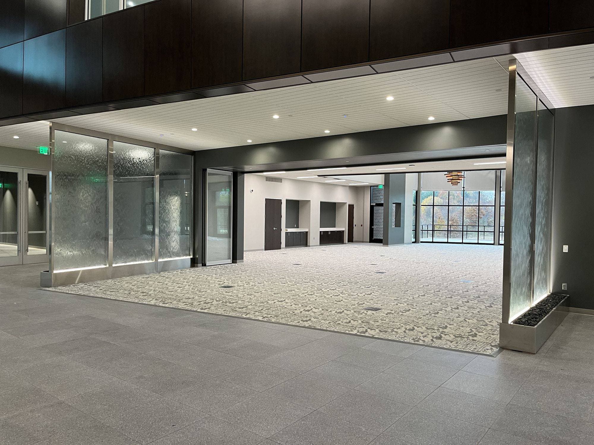 Room at Advia Credit Union fully open to the lobby with the Acousti-Clear panels stacked at the side