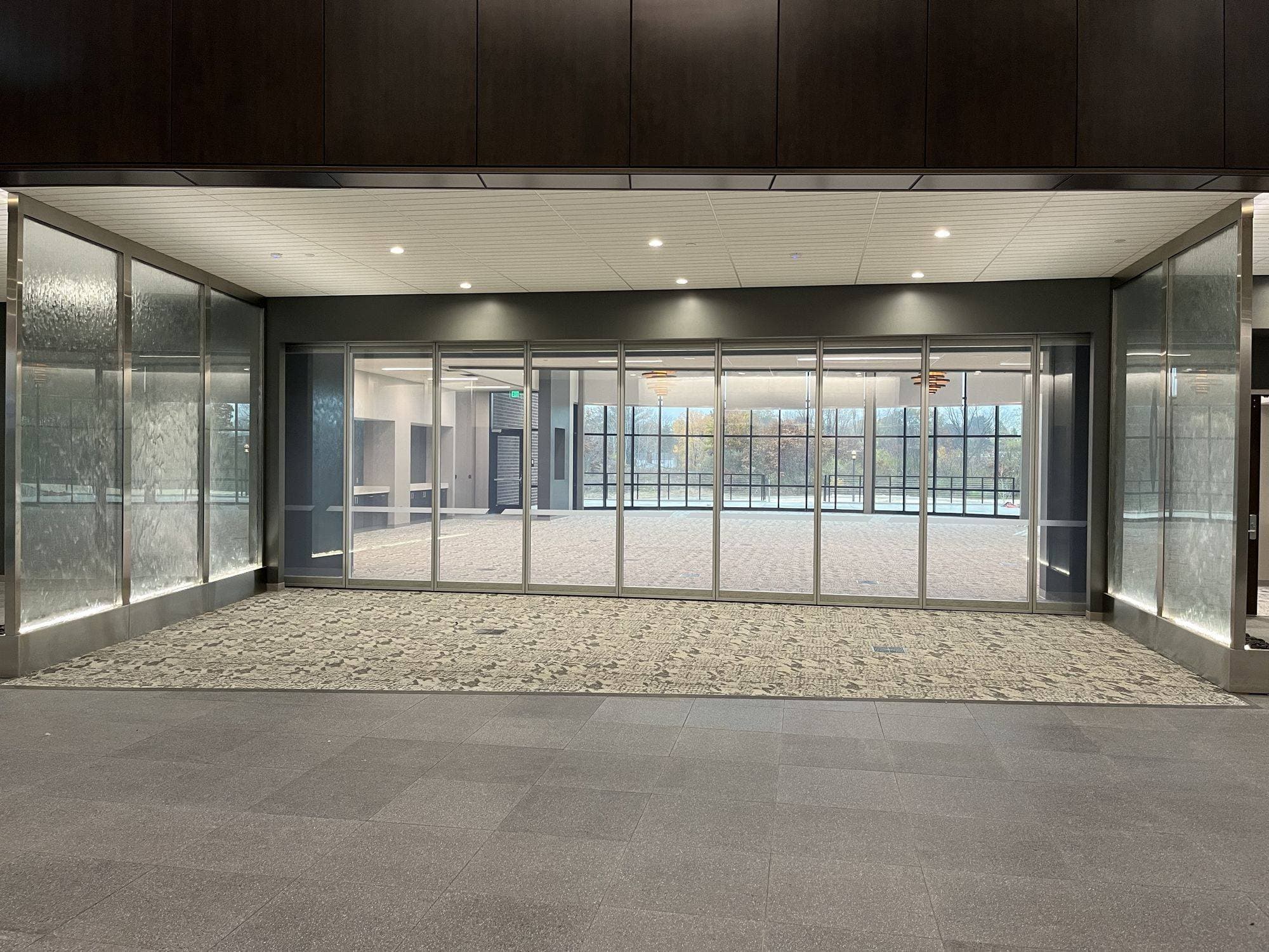 Straight-on view of the closed Acousti-Clear wall at Advia Credit Union with clear glass panels