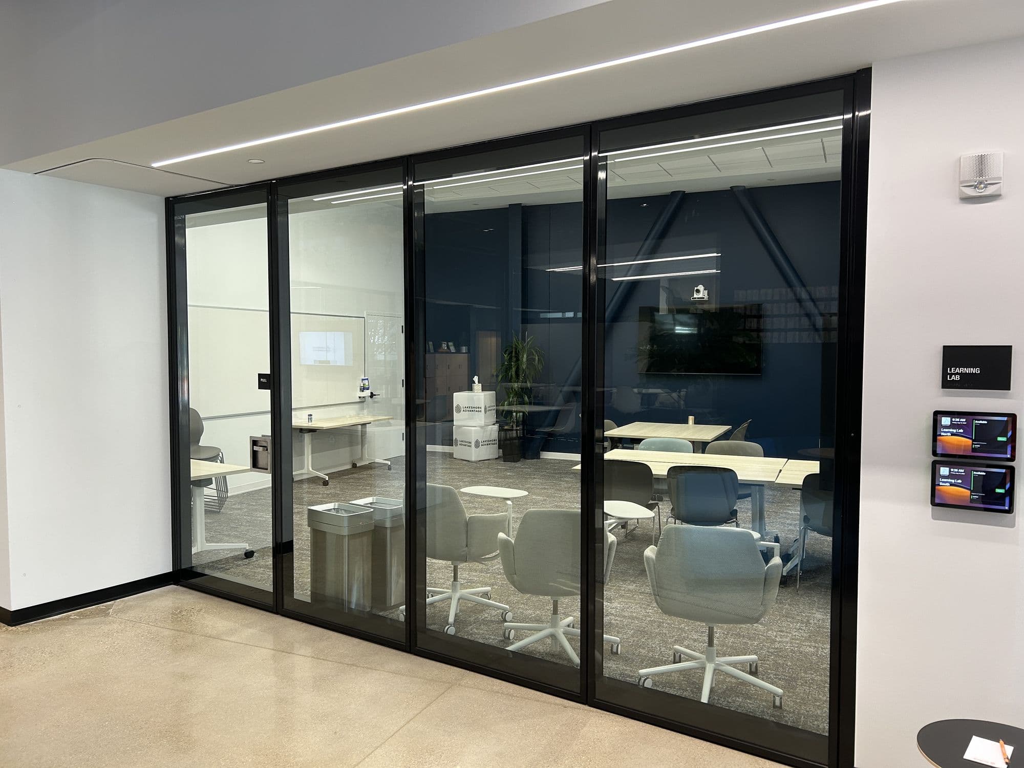 Straight-on view of the closed Acousti-Clear glass wall and the conference room behind it at Lakeshore Advantage