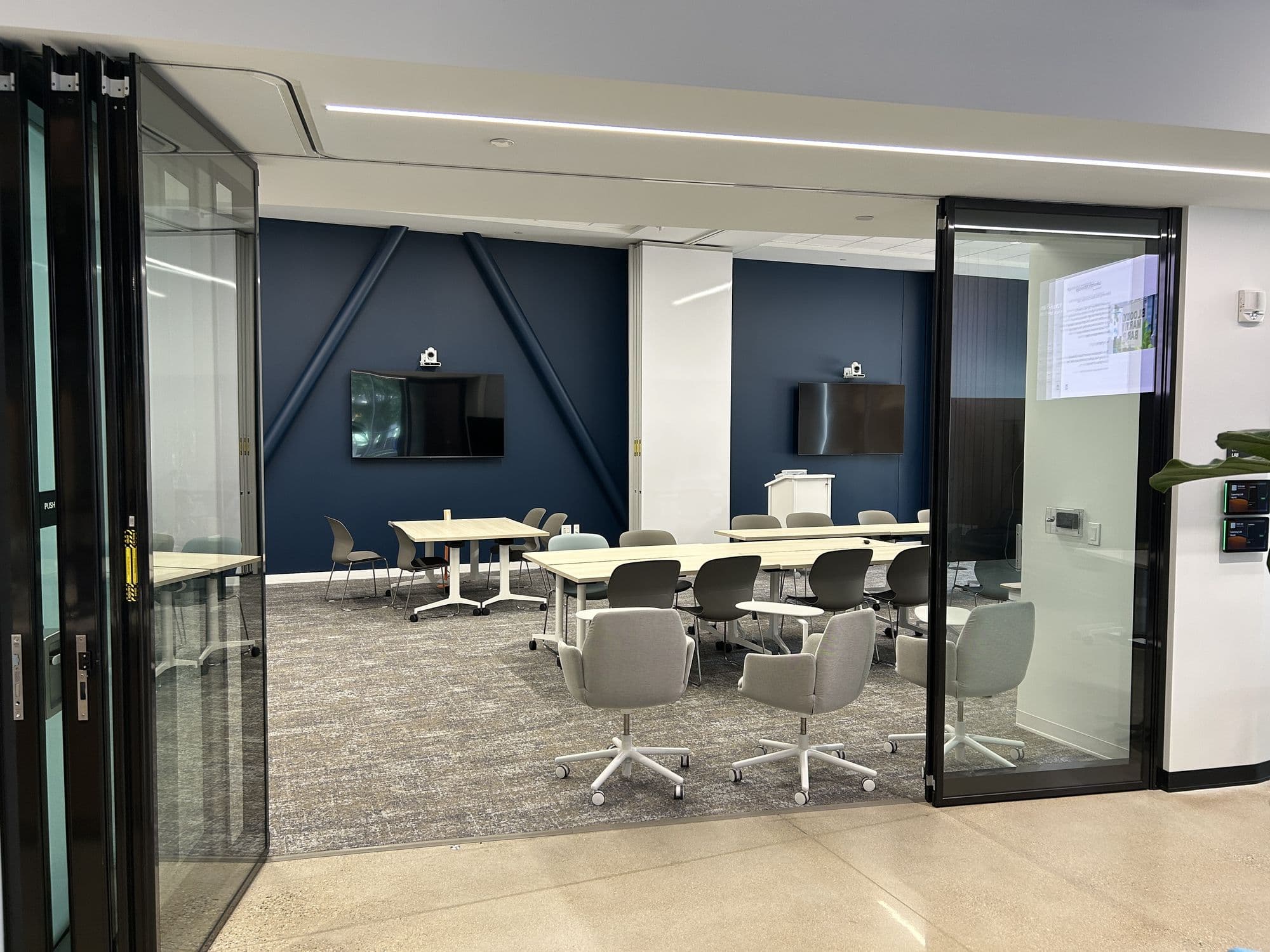 Lakeshore Advantage conference room open to the lobby with the Acousti-Clear panels stacked at the sides