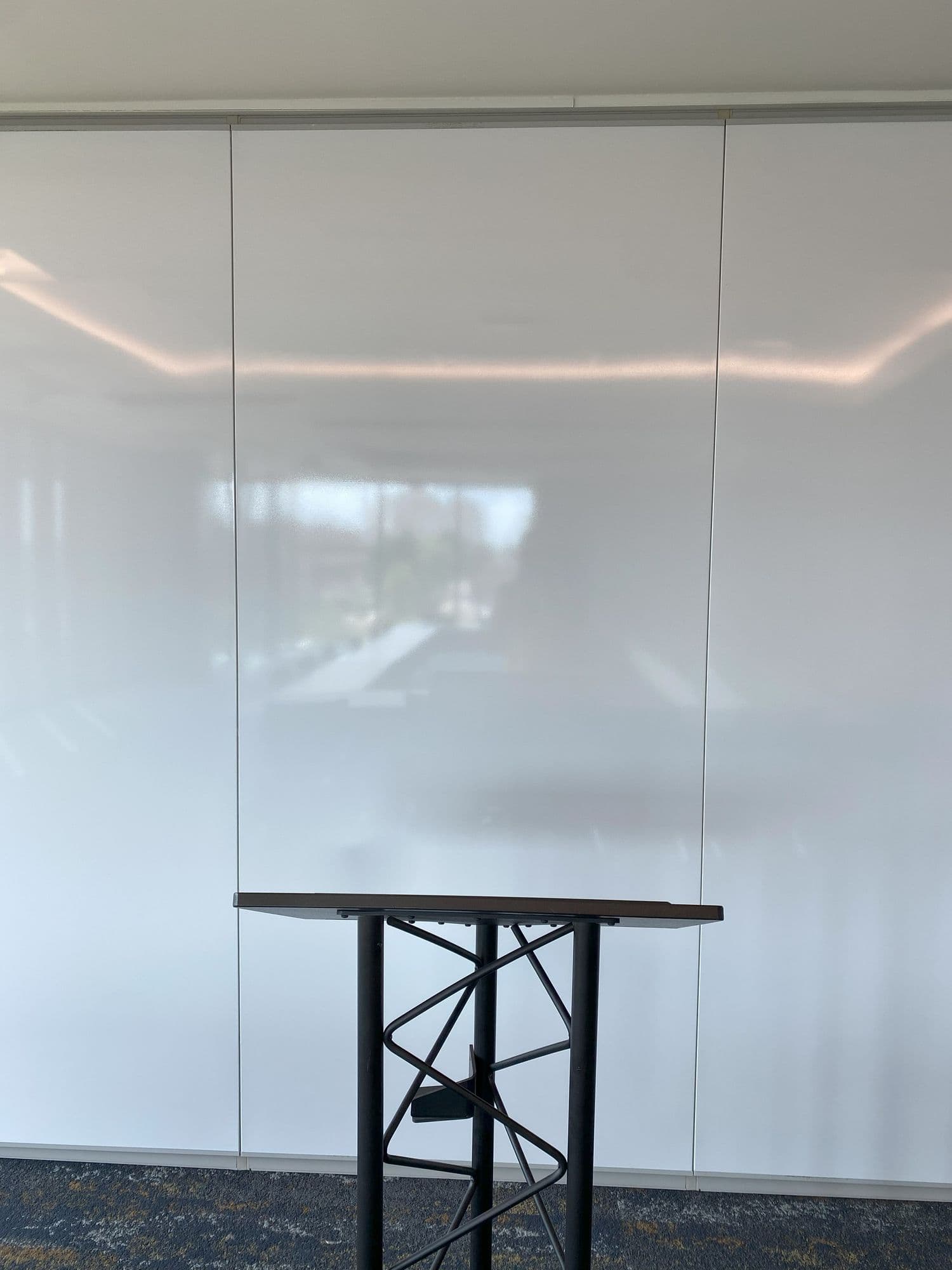 White markerboard finish on the Acousti-Seal panels behind a podium at Michigan Realtors
