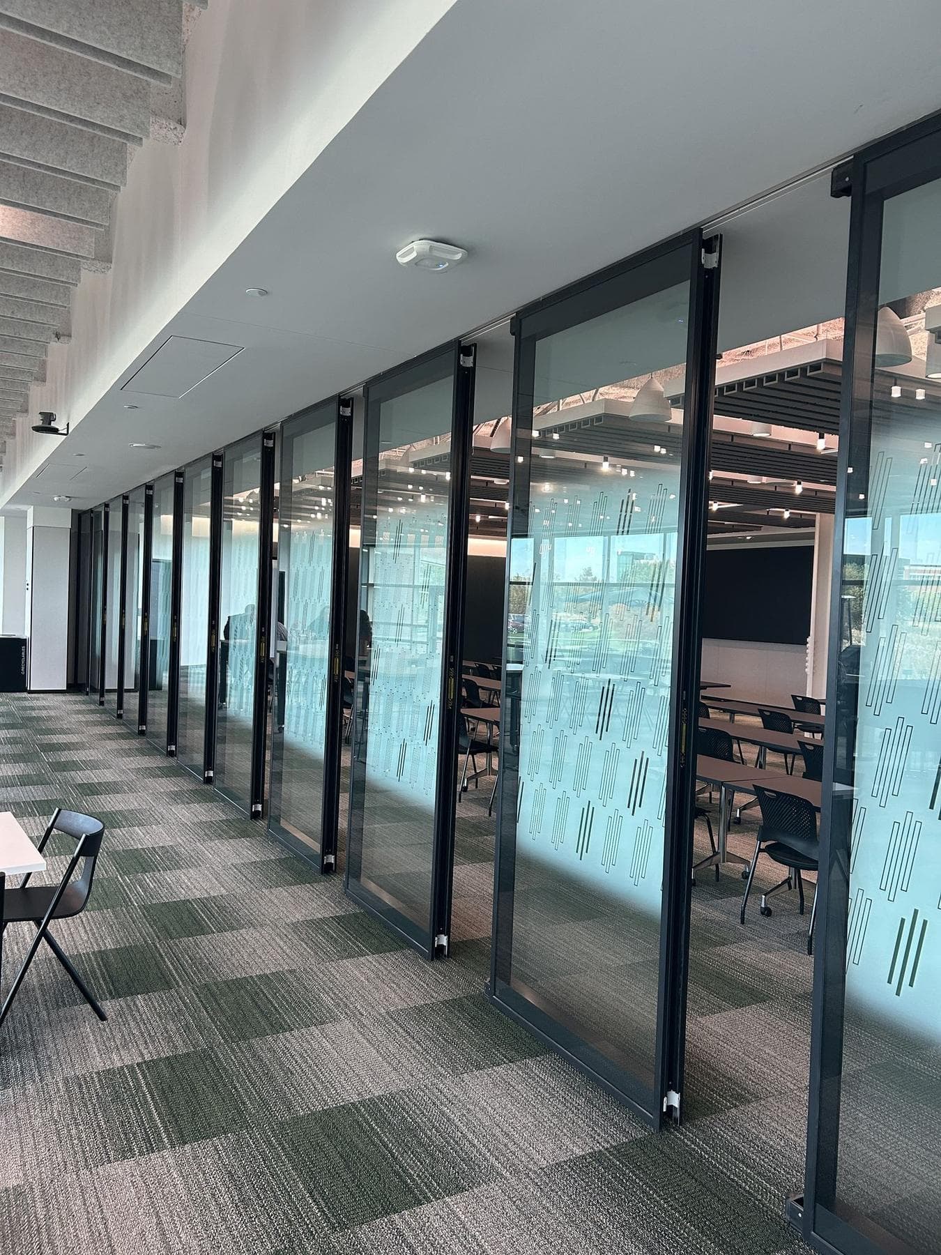 Perspective view down the long run of Acousti-Clear glass panels