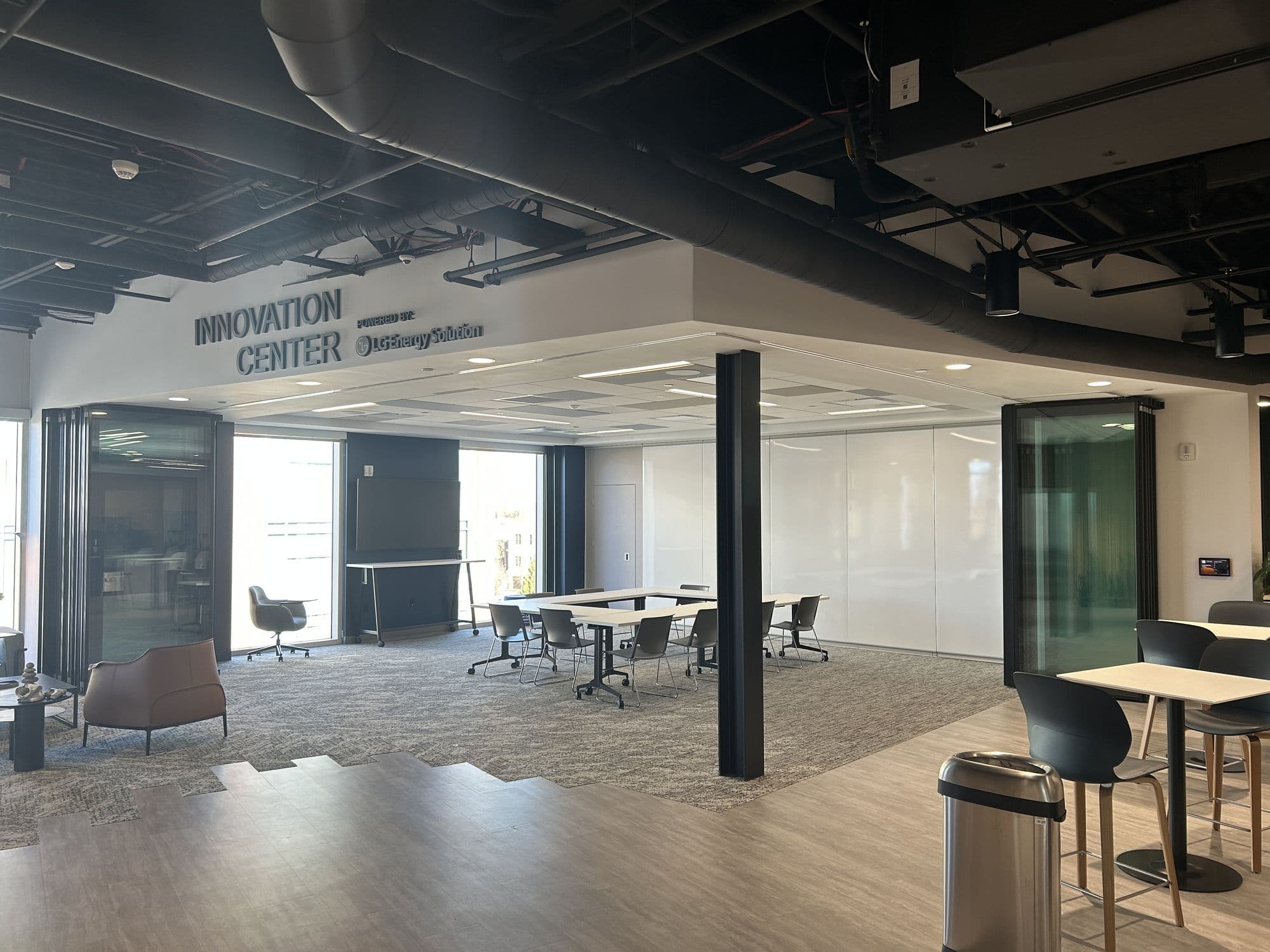 Innovation Center fully open to the office with the Acousti-Clear panels stacked at the sides