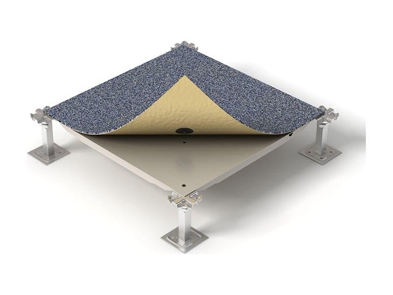 Carpet tile peeled back from a raised access floor panel, showing the positioning buttons on its underside