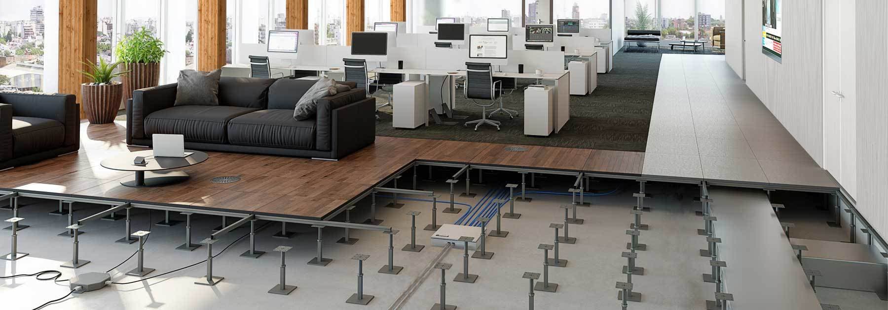 Cutaway of an open office raised access floor showing adjustable steel pedestals, stringers and underfloor cabling beneath wood-finish and carpeted floor panels