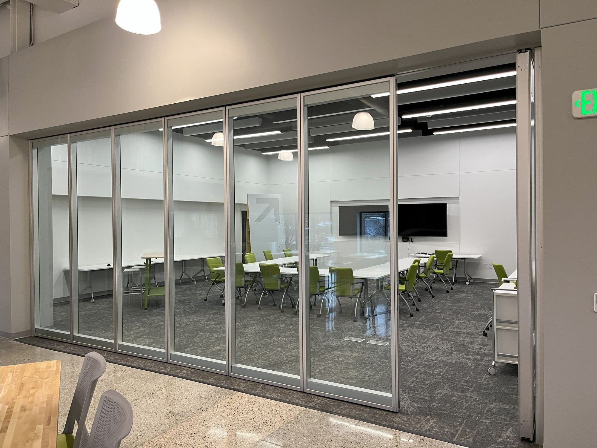 Closed Acousti-Clear glass wall at the GMB Learning Hub seen from an angle