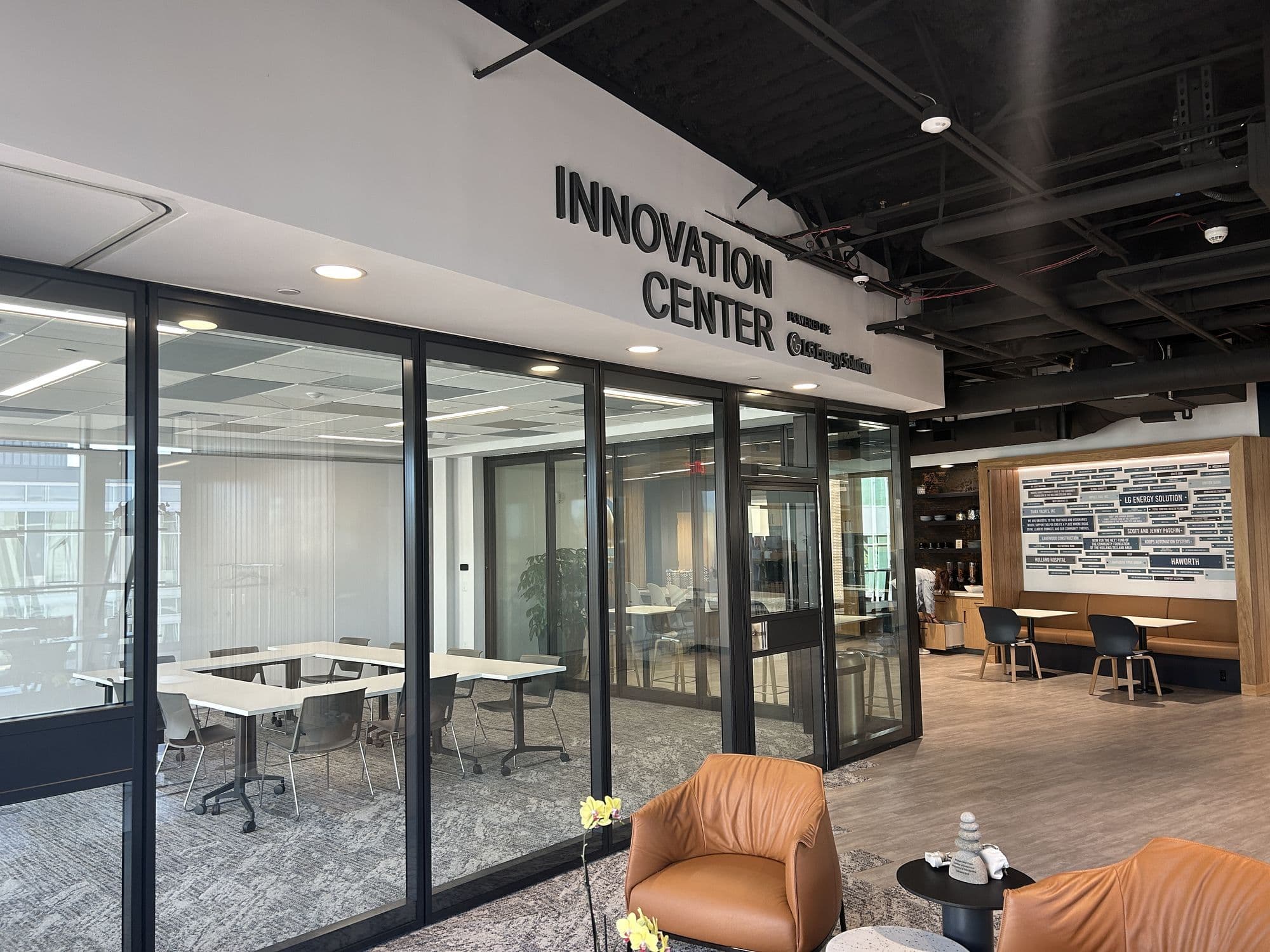 Closed Modernfold Acousti-Clear glass walls enclosing the Innovation Center at the West Coast Chamber of Commerce, seen from the corner
